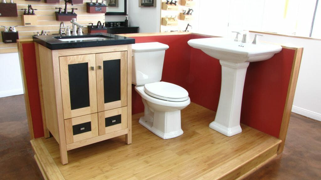 Sink and toilet displays inside the Ray May Plumbing showroom in Upland