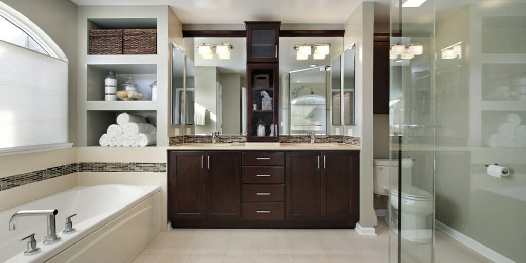 Master bath in luxury home with dark wood cabinetry After bathroom remodel - Master bath in luxury home with dark wood cabinetry